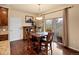 Cozy dining area with hardwood floors and sliding glass doors leading to the backyard at 11945 S Saunter Ln, Parker, CO 80138