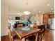 Cozy dining area adjacent to the kitchen and living room, perfect for Gathering meals at 11945 S Saunter Ln, Parker, CO 80138