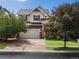 Charming two-story home featuring a well-kept lawn and a spacious driveway at 11945 S Saunter Ln, Parker, CO 80138