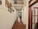 Elegant hallway with hardwood floors and stylish decor leading to the main living areas at 11945 S Saunter Ln, Parker, CO 80138