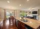 Open-concept kitchen with granite counters, stainless appliances, and a dining area at 11945 S Saunter Ln, Parker, CO 80138