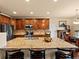 Kitchen boasts granite countertops, stainless steel appliances, and a spacious island at 11945 S Saunter Ln, Parker, CO 80138