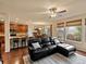 Open-concept living area with a modern kitchen, dining space, and comfortable lounge seating at 11945 S Saunter Ln, Parker, CO 80138