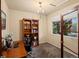 Cozy office space featuring natural light, built-in shelving, and a comfortable workspace at 11945 S Saunter Ln, Parker, CO 80138