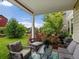 Covered patio with outdoor seating and a beautiful backyard view at 11945 S Saunter Ln, Parker, CO 80138