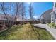 Backyard with a well-kept lawn, a tall wooden fence and tall trees at 8441 Urban Ct, Arvada, CO 80005