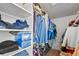 Walk-in closet with ample storage, shelving and hanging racks for clothes and accessories at 8441 Urban Ct, Arvada, CO 80005