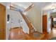 Spacious foyer with hardwood floors and a staircase leading to the upper level at 8441 Urban Ct, Arvada, CO 80005