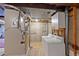 This laundry room features a washer, dryer and cabinetry on a cement floor at 8441 Urban Ct, Arvada, CO 80005