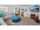 Spacious living room with a cozy sofa and adjacent dining area, perfect for gatherings at 8441 Urban Ct, Arvada, CO 80005