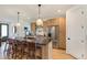 Modern kitchen with large island, stainless steel appliances, and stylish pendant lighting at 2453 Chase St, Edgewater, CO 80214