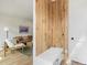 Bright living room with wood accent wall and a cozy seating area at 2453 Chase St, Edgewater, CO 80214