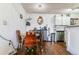 Dining area featuring a round table, stylish chairs, unique light fixture, and a modern sideboard at 10150 E Virginia Ave # 19-303, Denver, CO 80247