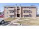 A multi-Gathering home with private balconies and designated parking spots in front of the building at 10150 E Virginia Ave # 19-303, Denver, CO 80247