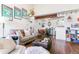 Spacious living room with open layout, dining area, comfortable seating, and stylish decor at 10150 E Virginia Ave # 19-303, Denver, CO 80247