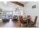 Cozy living room and dining area with natural light, comfortable seating, and wood accents at 10150 E Virginia Ave # 19-303, Denver, CO 80247