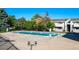 Community swimming pool with surrounding deck at 10150 E Virginia Ave # 19-303, Denver, CO 80247