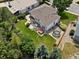 Drone view of the backyard, showing the patio, green lawn, hot tub, trampoline, and mature trees at 3043 W 109Th Pl, Westminster, CO 80031