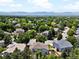Aerial view of a lush, green neighborhood showcasing the serene mountain view in the background at 3043 W 109Th Pl, Westminster, CO 80031