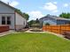 Fenced backyard with a trampoline and hot tub, creating a private outdoor entertainment space at 3043 W 109Th Pl, Westminster, CO 80031
