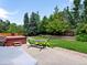Relaxing backyard featuring lush greenery, a hot tub, and a hammock, perfect for outdoor enjoyment at 3043 W 109Th Pl, Westminster, CO 80031