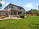 Spacious backyard with a well-maintained lawn, patio seating, and a hot tub, ideal for entertaining at 3043 W 109Th Pl, Westminster, CO 80031