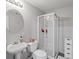 Basement bathroom features a modern vanity with a walk-in shower at 3043 W 109Th Pl, Westminster, CO 80031