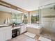Bright bathroom showcases a double sink vanity, glass enclosed shower, and luxurious soaking tub at 3043 W 109Th Pl, Westminster, CO 80031