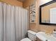 A cozy bathroom with a shower, toilet, sink, and mirror at 3043 W 109Th Pl, Westminster, CO 80031