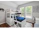 A bedroom designed with a bunk bed, soft rug, and decor at 3043 W 109Th Pl, Westminster, CO 80031
