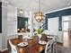 Open dining area with a view into the living room, featuring modern lighting and decor at 3043 W 109Th Pl, Westminster, CO 80031