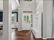 Inviting foyer with hardwood floors, a charming entry bench, and bright natural light at 3043 W 109Th Pl, Westminster, CO 80031
