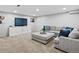 The finished basement living room offers neutral decor, gray couches, and plush carpeting at 3043 W 109Th Pl, Westminster, CO 80031