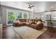 Spacious open-concept living area with a large sectional sofa and lots of natural light at 3043 W 109Th Pl, Westminster, CO 80031