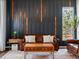 Stylish living room with dark accent wall, modern decor, and a cozy leather sofa at 3043 W 109Th Pl, Westminster, CO 80031