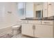 Well-lit bathroom features a tiled shower/bath combo and granite vanity at 4903 Basalt Ridge Cir, Castle Rock, CO 80108
