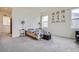 Spacious bedroom features soft carpet, large windows, and modern furniture at 4903 Basalt Ridge Cir, Castle Rock, CO 80108