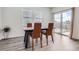 Dining area featuring neutral walls, laminate floors, and a sliding door to the yard at 4903 Basalt Ridge Cir, Castle Rock, CO 80108
