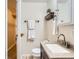 Bathroom featuring sink, toilet, and mirror at 3304 W 3Rd Ave, Denver, CO 80219