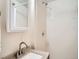 Bathroom featuring shower, sink, and mirror at 3304 W 3Rd Ave, Denver, CO 80219