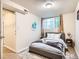 This bedroom features a comfortable bed, window, and carpet at 3304 W 3Rd Ave, Denver, CO 80219