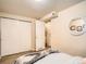 Bedroom featuring a closet and a view into the laundry room at 3304 W 3Rd Ave, Denver, CO 80219