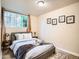 This bedroom features a comfortable bed, window, and carpet at 3304 W 3Rd Ave, Denver, CO 80219