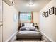 This bedroom features a comfortable bed, window, and carpet at 3304 W 3Rd Ave, Denver, CO 80219