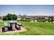 Picturesque view of the city skyline from a tranquil park setting, showcasing a bench seat at 3304 W 3Rd Ave, Denver, CO 80219