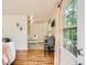 Open dining area with a table, stylish seating, a window and hardwood flooring at 3304 W 3Rd Ave, Denver, CO 80219