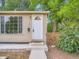 Inviting home entrance with a charming front door, window, and landscaped surroundings at 3304 W 3Rd Ave, Denver, CO 80219