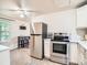 Well-equipped kitchen with stainless steel appliances, white cabinets, and a bright, airy atmosphere at 3304 W 3Rd Ave, Denver, CO 80219