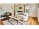 Inviting living area with stylish furniture, bright windows and hardwood flooring at 3304 W 3Rd Ave, Denver, CO 80219