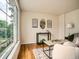 Bright living room featuring hardwood floors, a large window and stylish furniture at 3304 W 3Rd Ave, Denver, CO 80219